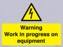 warning-work-in-progress-on-equipmentwith-electrical-hazard-symbol~